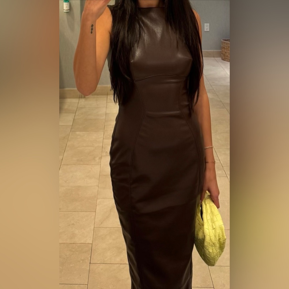 Sleeveless vegan leather dress. Worn ones.